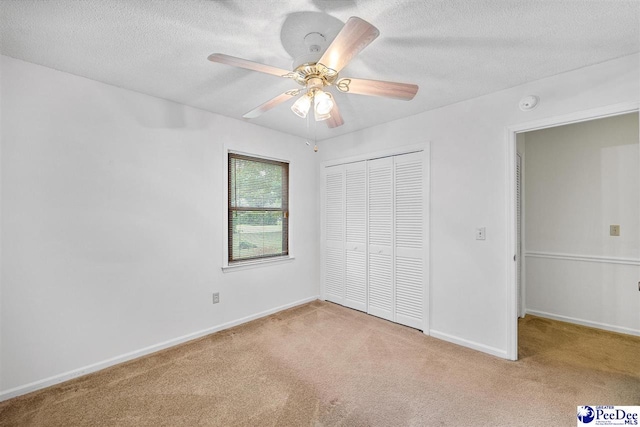 2 Bayswater Rd, Quinby, SC 29506 - unfurnished bedroom featuring light carpet, ceiling fan, a closet, and a textured ceiling