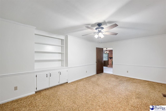 2 Bayswater Rd, Quinby, SC 29506 - carpeted empty room featuring ornamental molding, built in features, and ceiling fan