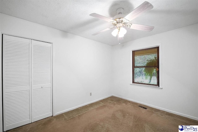 2 Bayswater Rd, Quinby, SC 29506 - unfurnished bedroom with ceiling fan, carpet, a textured ceiling, and a closet