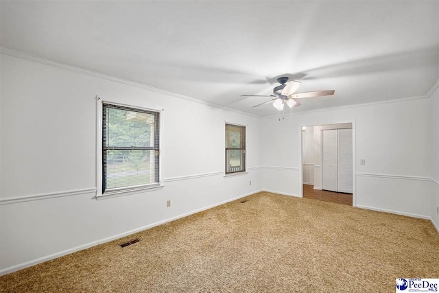 2 Bayswater Rd, Quinby, SC 29506 - spare room with crown molding, ceiling fan, and carpet