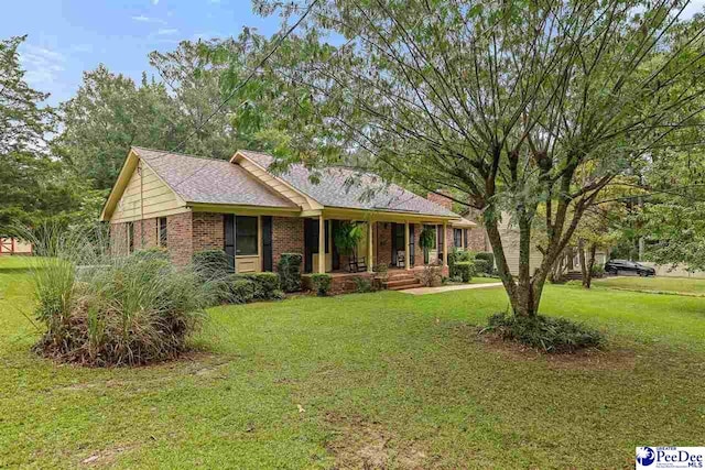 2 Bayswater Rd, Quinby, SC 29506 - ranch-style home with covered porch and a front lawn