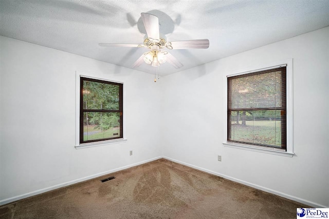 2 Bayswater Rd, Quinby, SC 29506 - empty room with a textured ceiling, carpet floors, and ceiling fan