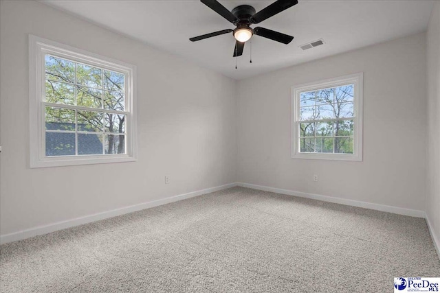 1844 Joseph Cir, Florence, SC 29501 - empty room featuring healthy amount of natural light, baseboards, and carpet floors