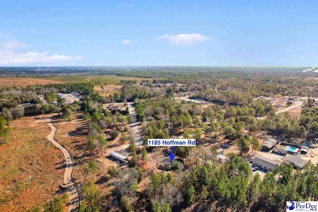 bird's eye view featuring a forest view