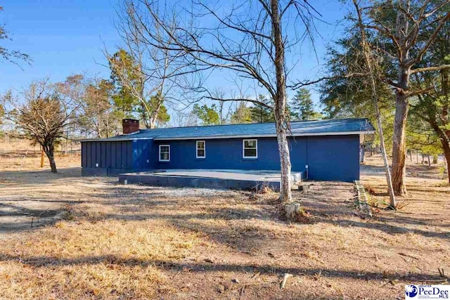 exterior space featuring a chimney