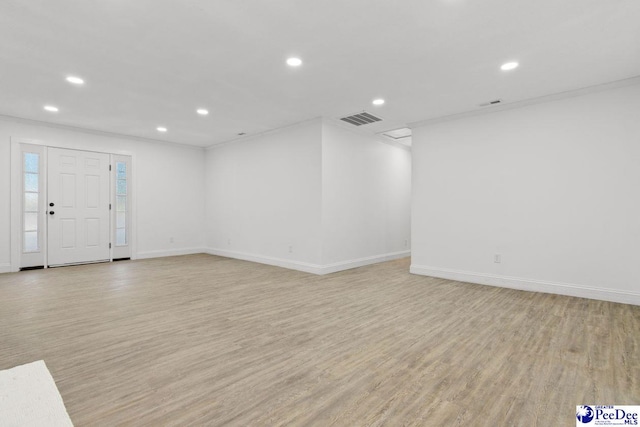 interior space featuring recessed lighting, visible vents, and light wood finished floors