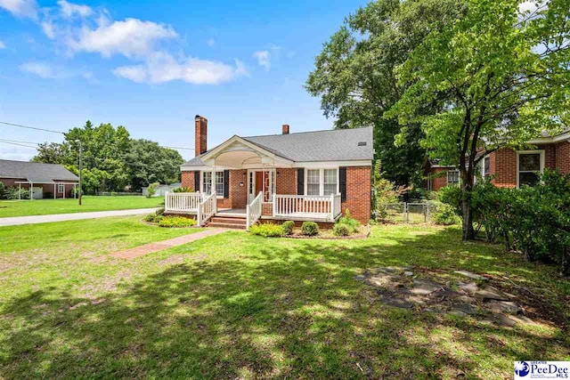 1461 King Ave, Florence, SC 29501 - bungalow-style house featuring a chimney, a porch, and brick siding