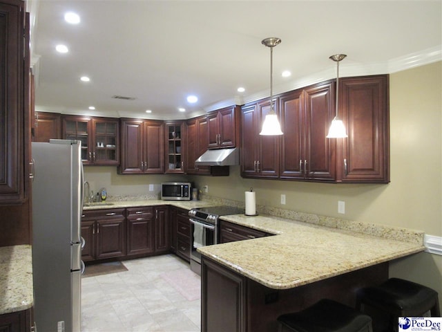 kitchen featuring under cabinet range hood, decorative light fixtures, recessed lighting, a peninsula, and stainless steel appliances