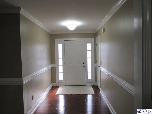 entrance foyer featuring crown molding, baseboards, and wood finished floors