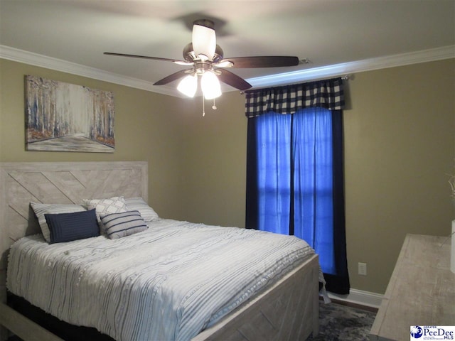 bedroom with ceiling fan, baseboards, and ornamental molding