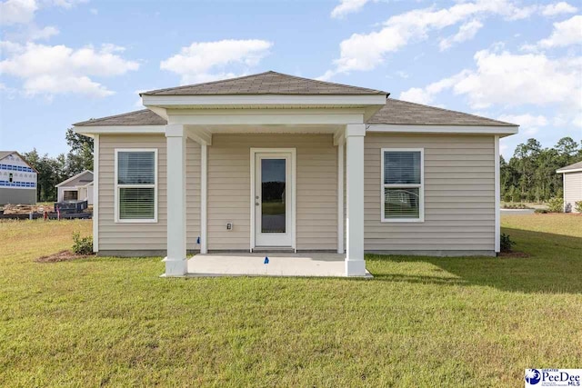 563 Strawberry Field Way, Galivants Ferry, SC 29544 - rear view of property featuring a patio, a yard, and a shingled roof