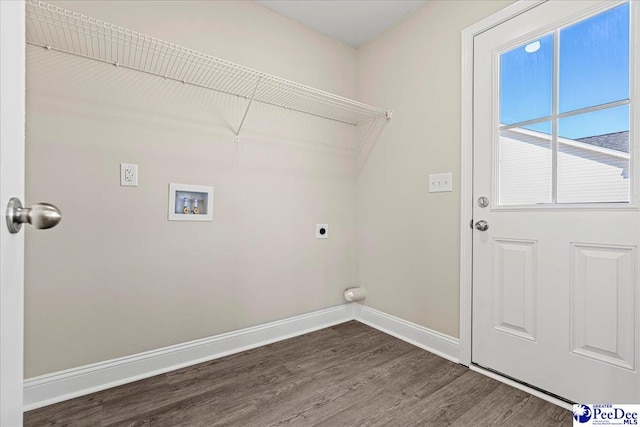 laundry room with hookup for a washing machine, laundry area, dark wood-type flooring, baseboards, and electric dryer hookup