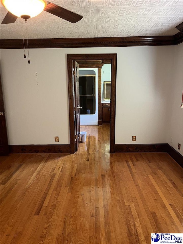 1840 New Zion Rd, Lake City, SC 29560 - unfurnished room with wood-type flooring, a ceiling fan, and crown molding