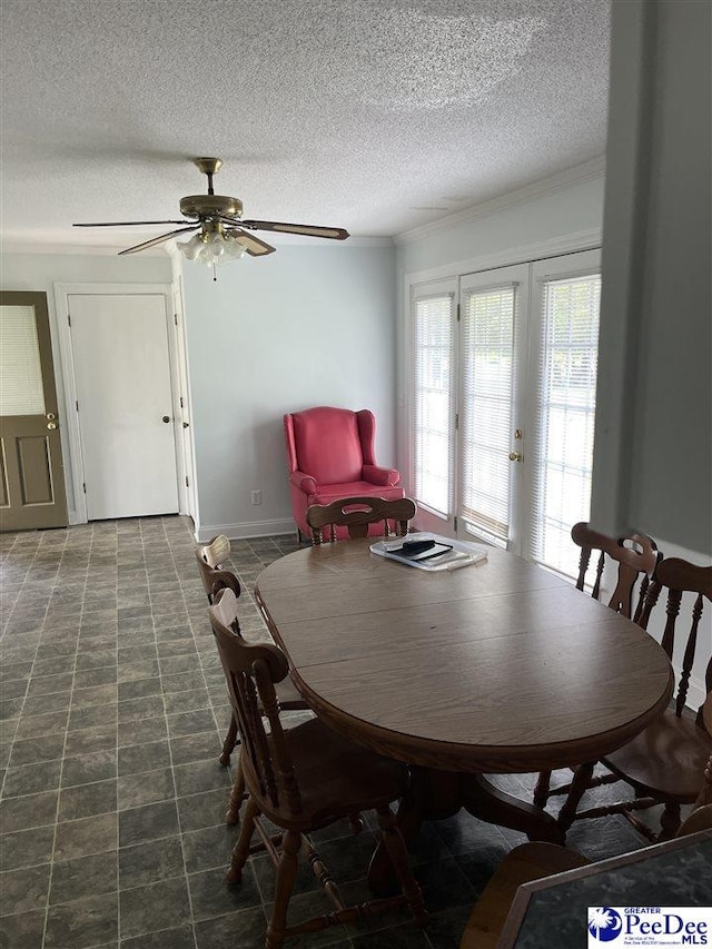 1840 New Zion Rd, Lake City, SC 29560 - dining area featuring a textured ceiling, french doors, ceiling fan, and crown molding