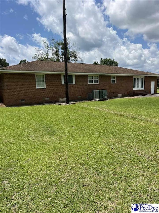 1840 New Zion Rd, Lake City, SC 29560 - rear view of house featuring crawl space, a yard, and brick siding