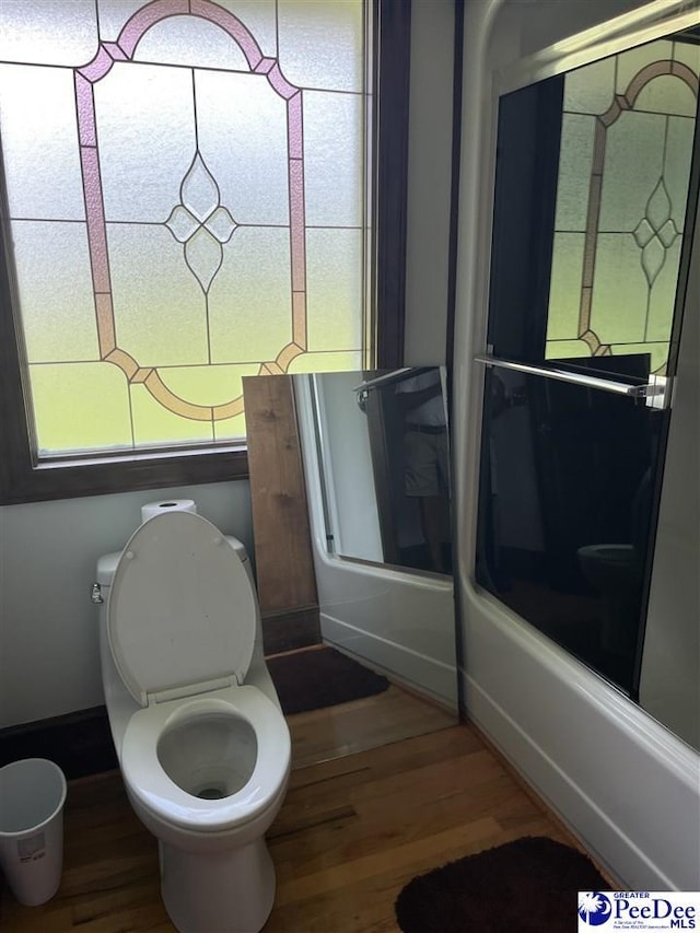 1840 New Zion Rd, Lake City, SC 29560 - bathroom with wood finished floors and bathing tub / shower combination