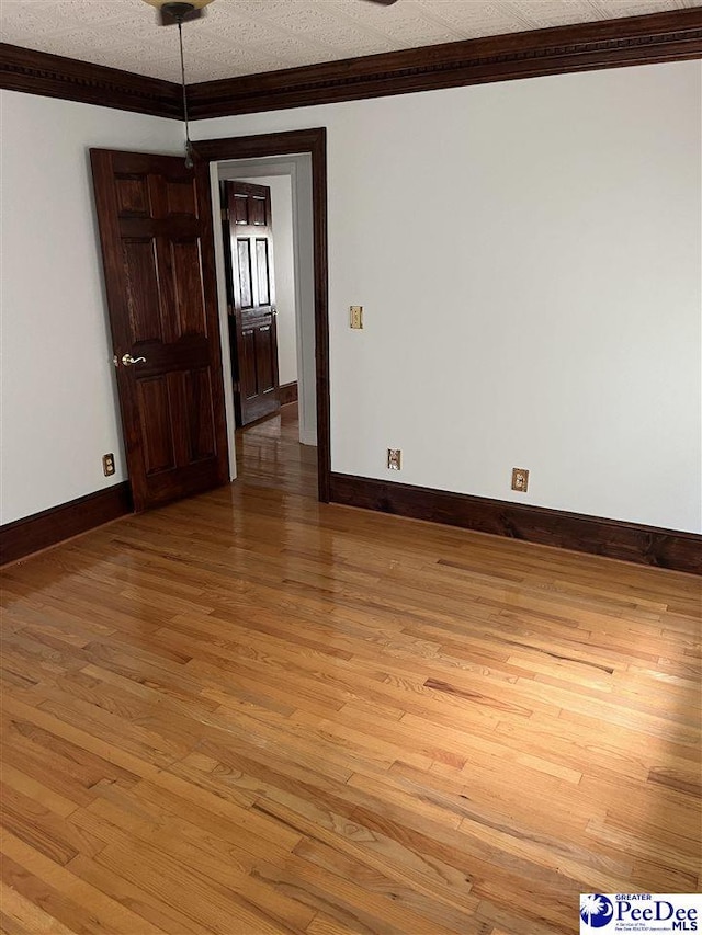 1840 New Zion Rd, Lake City, SC 29560 - unfurnished room with light wood-style floors and crown molding