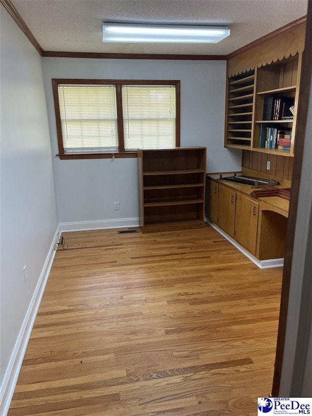 1840 New Zion Rd, Lake City, SC 29560 - interior space with light wood finished floors, a textured ceiling, and crown molding