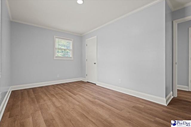 434 Heidi Dr, Pamplico, SC 29583 - spare room featuring baseboards, wood finished floors, ornamental molding, and recessed lighting
