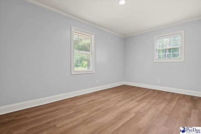 434 Heidi Dr, Pamplico, SC 29583 - spare room with plenty of natural light, wood finished floors, crown molding, and baseboards