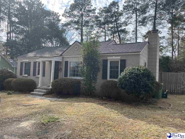 ranch-style house with a front yard