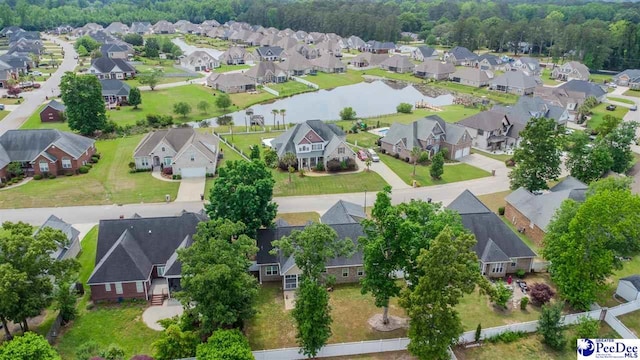 bird's eye view featuring a residential view and a water view