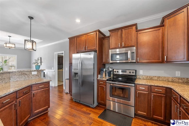 kitchen featuring appliances with stainless steel finishes, light stone countertops, ornamental molding, dark wood finished floors, and hanging light fixtures