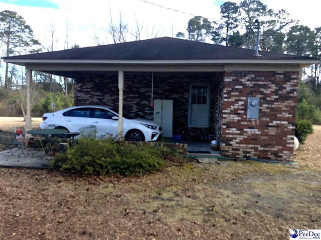 exterior space with a carport