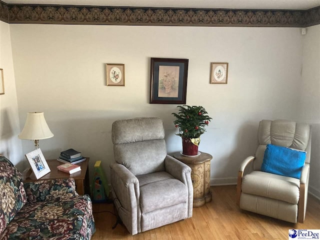 living area with light hardwood / wood-style flooring