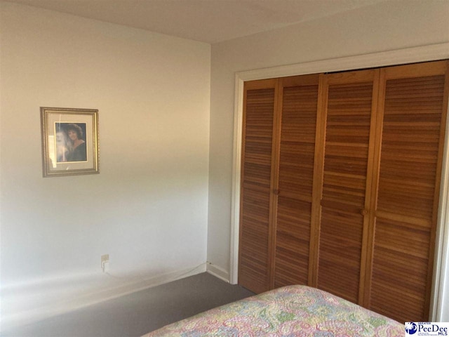 unfurnished bedroom with a closet