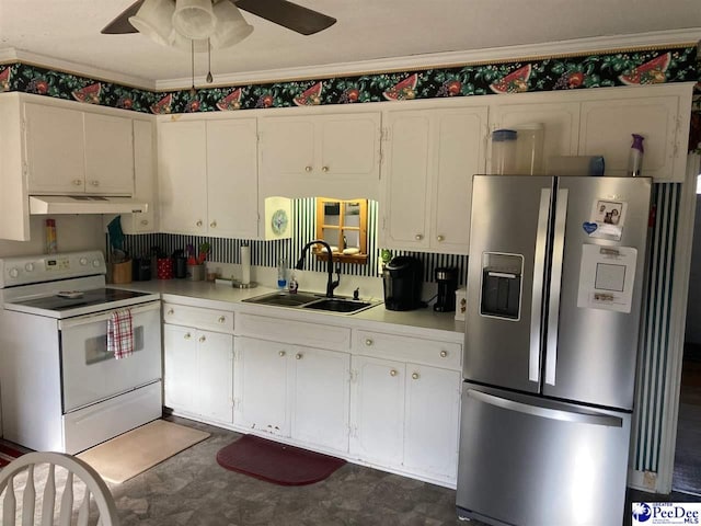 kitchen with sink, stainless steel fridge, ceiling fan, electric range, and white cabinets