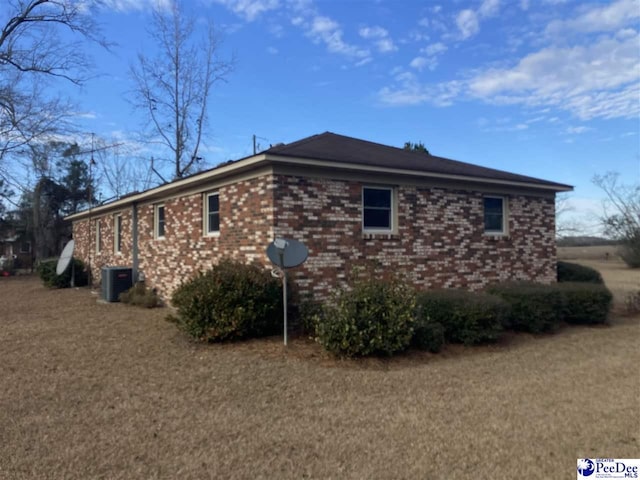 view of side of property with central AC