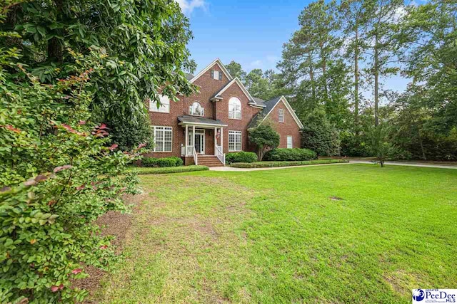 3326 Tennyson Dr, Florence, SC 29501 - view of front of home with brick siding and a front yard