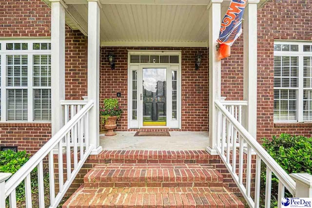 3326 Tennyson Dr, Florence, SC 29501 - doorway to property featuring brick siding and covered porch