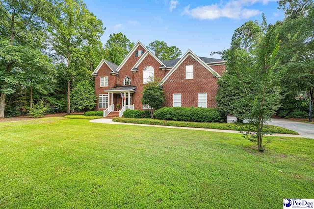 3326 Tennyson Dr, Florence, SC 29501 - view of front of home featuring a front lawn and brick siding