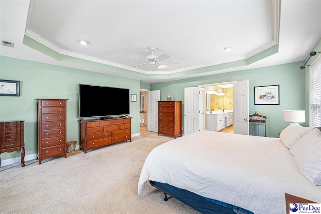 3326 Tennyson Dr, Florence, SC 29501 - bedroom with a tray ceiling, crown molding, carpet floors, ceiling fan, and ensuite bath