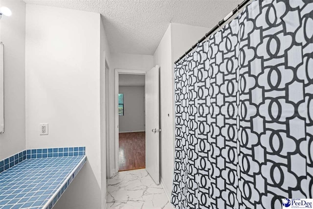 548 Mciver Rd, Florence, SC 29506 - full bath with marble finish floor and a textured ceiling
