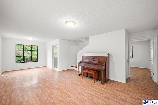 548 Mciver Rd, Florence, SC 29506 - sitting room featuring light wood finished floors, baseboards, and a textured ceiling