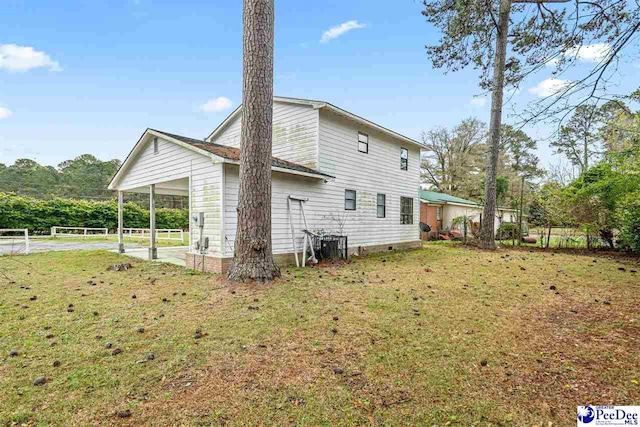 548 Mciver Rd, Florence, SC 29506 - back of property with an attached carport and a yard