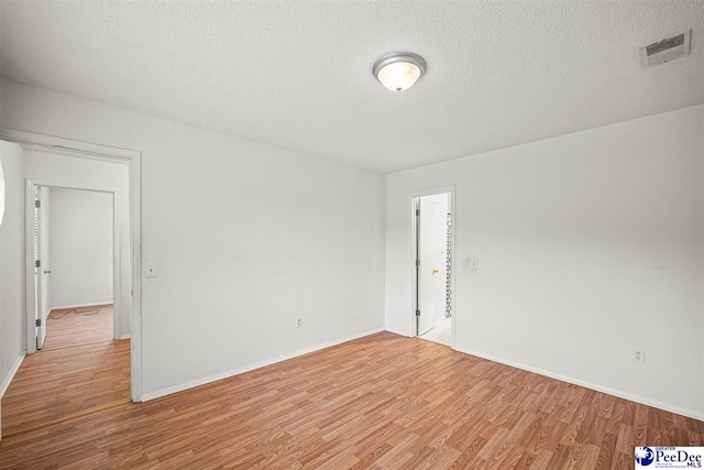 548 Mciver Rd, Florence, SC 29506 - spare room featuring visible vents, a textured ceiling, and light wood-style flooring