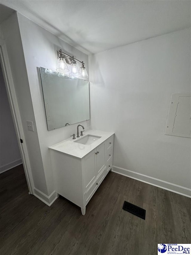 bathroom featuring wood-type flooring and vanity