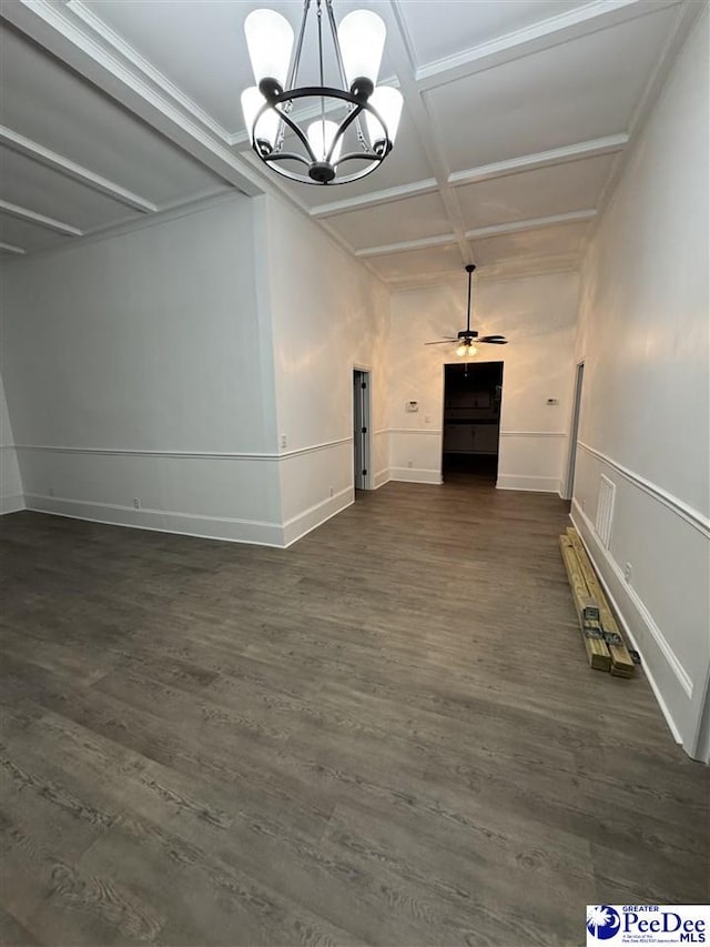 unfurnished living room with coffered ceiling, ceiling fan with notable chandelier, dark hardwood / wood-style flooring, and beam ceiling