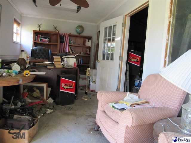 office area with ceiling fan, plenty of natural light, and concrete floors