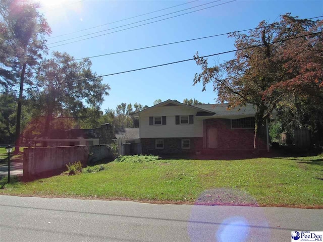 tri-level home featuring a front yard