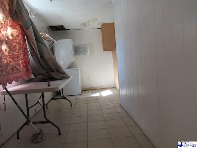 laundry room featuring washer / clothes dryer and light tile patterned floors