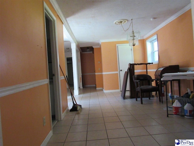 interior space with tile patterned flooring and ornamental molding