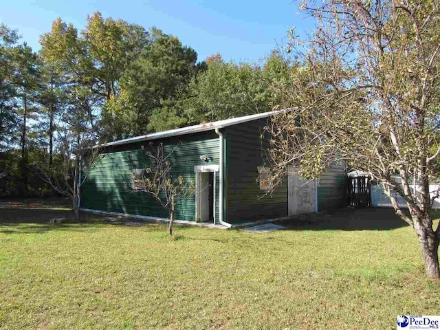 view of outbuilding with a lawn