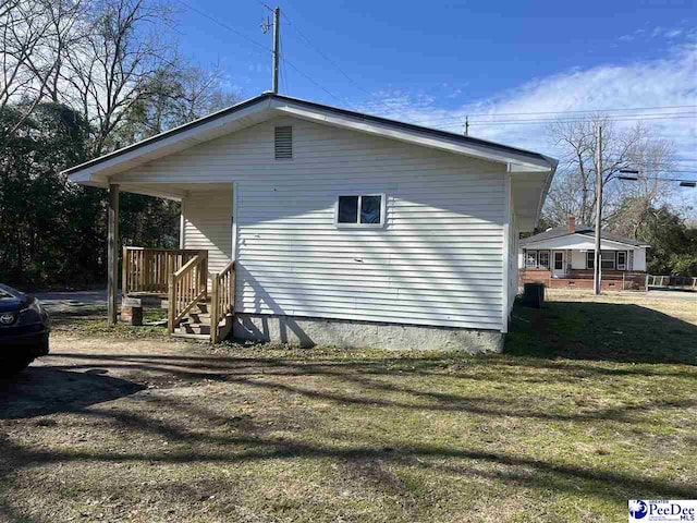 view of home's exterior with a yard