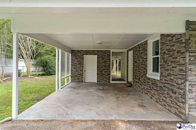 view of patio / terrace featuring an attached carport