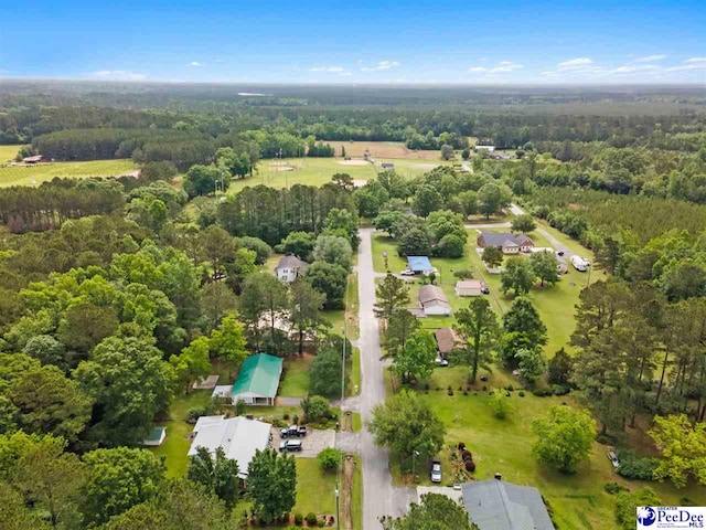aerial view of property's location with a forest